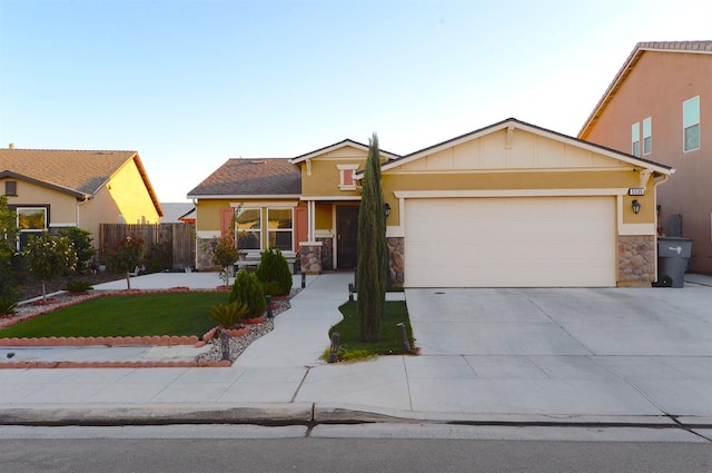 view of front facade featuring a garage and a front lawn