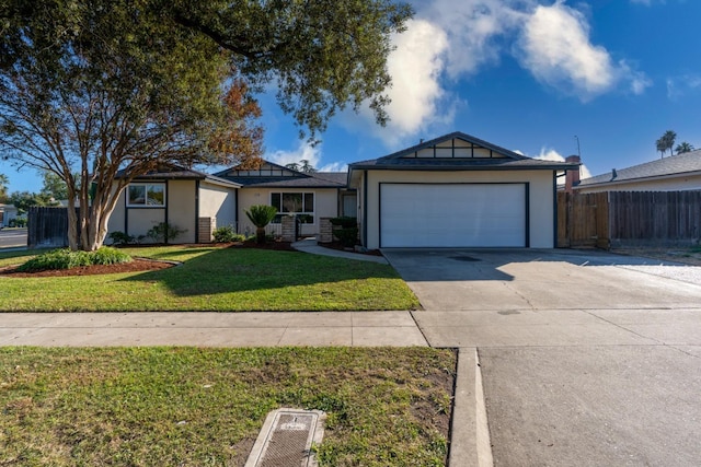 single story home featuring a garage and a front yard