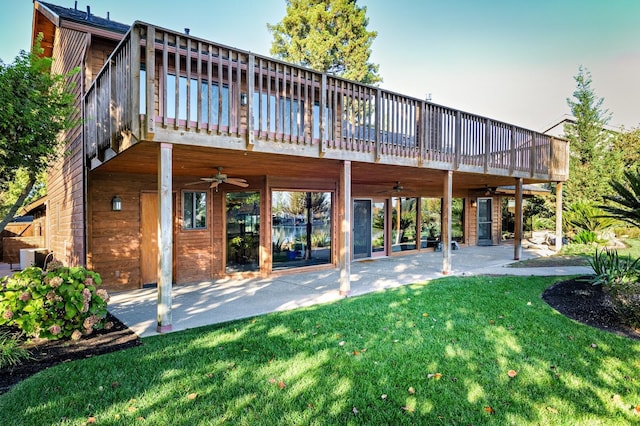 back of property featuring a patio, a lawn, and ceiling fan