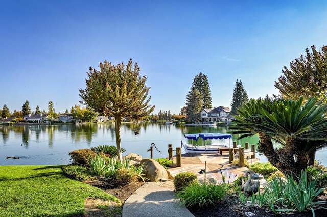 property view of water with a dock