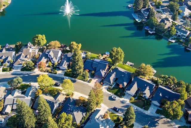 bird's eye view with a residential view and a water view