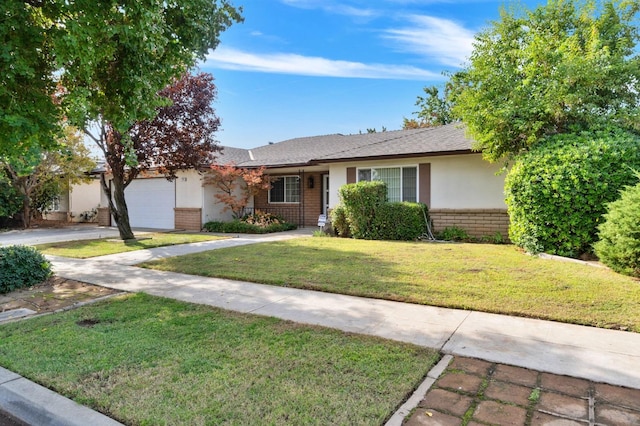 ranch-style home with a garage and a front yard