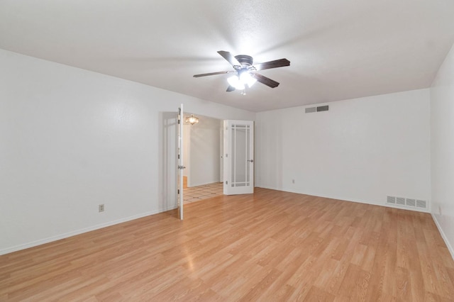 empty room featuring light wood-type flooring and ceiling fan