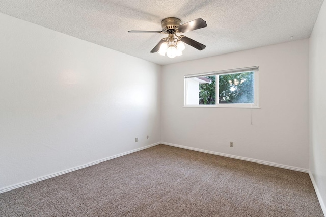 unfurnished room with ceiling fan, a textured ceiling, and carpet floors