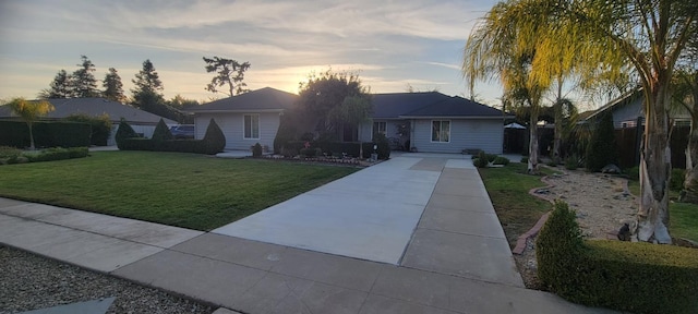 ranch-style house with a yard