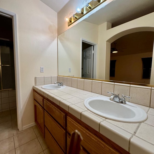 bathroom featuring vanity, tile patterned floors, and ceiling fan