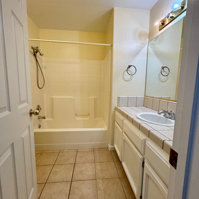 bathroom with washtub / shower combination, tile patterned floors, and vanity