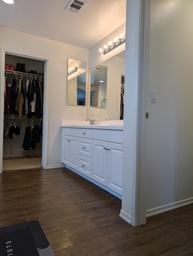 bathroom featuring vanity and hardwood / wood-style floors