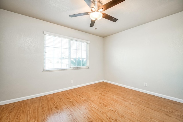 empty room featuring hardwood / wood-style floors and ceiling fan