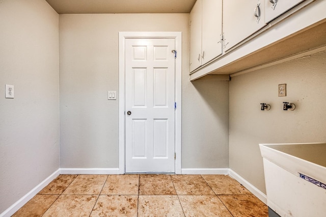 washroom with cabinets and light tile patterned floors