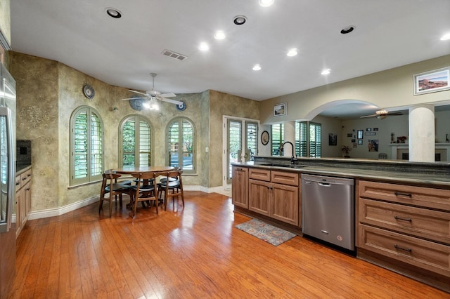 kitchen with ceiling fan, dishwasher, light wood-type flooring, and sink