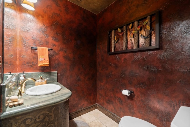 bathroom featuring tile patterned floors, vanity, and toilet