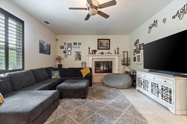 living room with tile patterned floors and ceiling fan