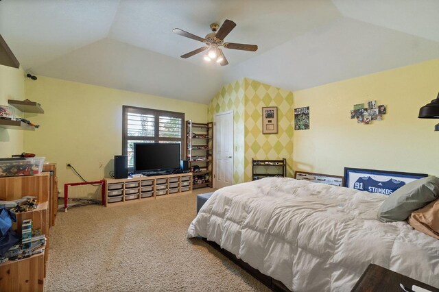 carpeted bedroom with ceiling fan and lofted ceiling