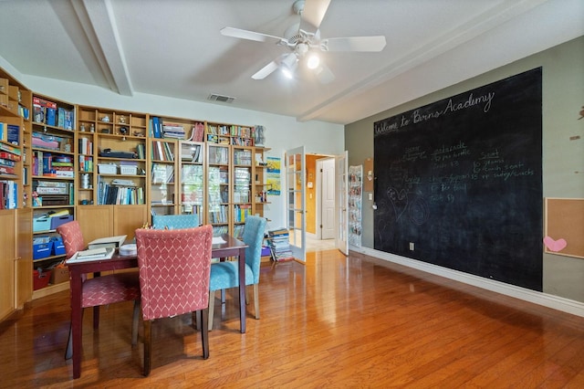 dining room featuring wood-type flooring and ceiling fan