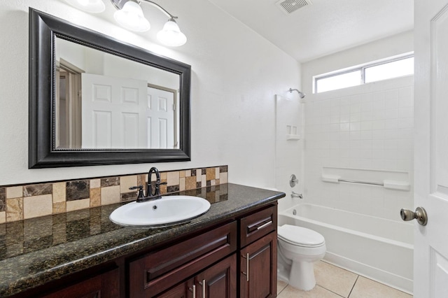 full bathroom with toilet, tile patterned floors, vanity, shower / bathtub combination, and backsplash