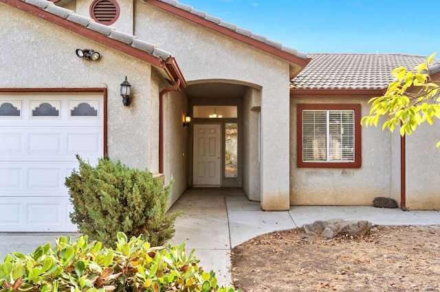 doorway to property featuring a garage