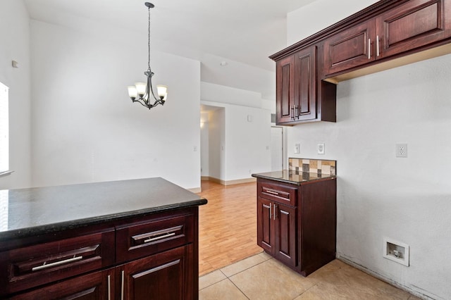 kitchen featuring light hardwood / wood-style floors, hanging light fixtures, and a chandelier