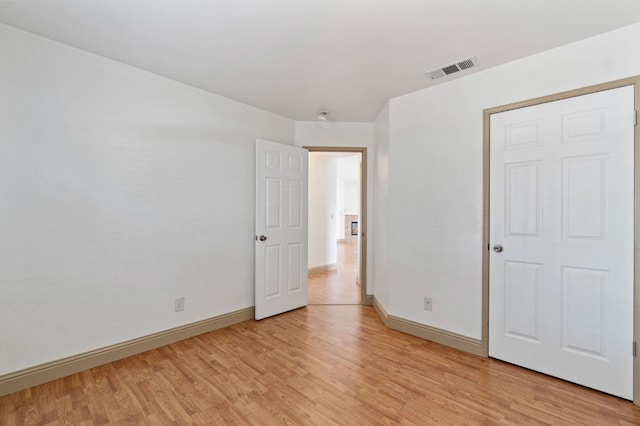 unfurnished bedroom featuring light wood-type flooring