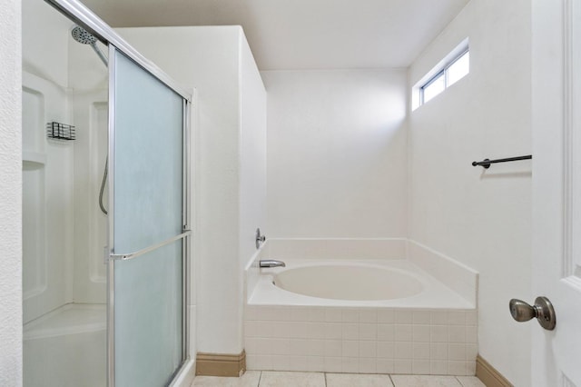 bathroom featuring independent shower and bath and tile patterned floors