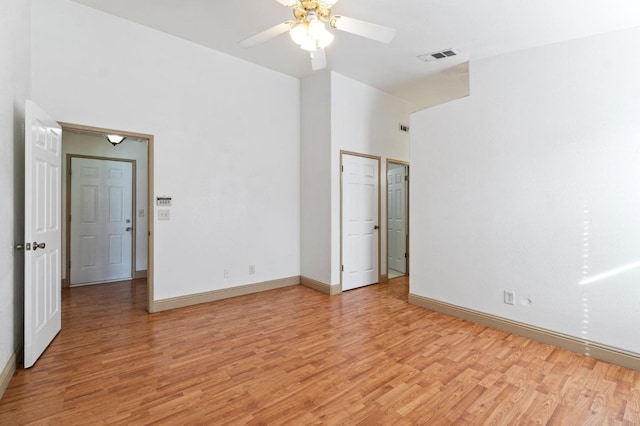 unfurnished bedroom with ceiling fan and light hardwood / wood-style flooring