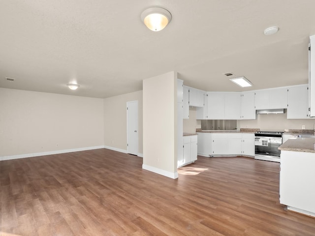 kitchen featuring white cabinetry, white range, and hardwood / wood-style flooring