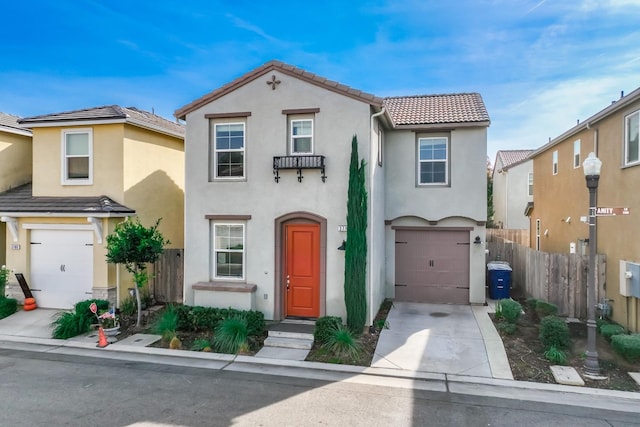 mediterranean / spanish-style home with a garage