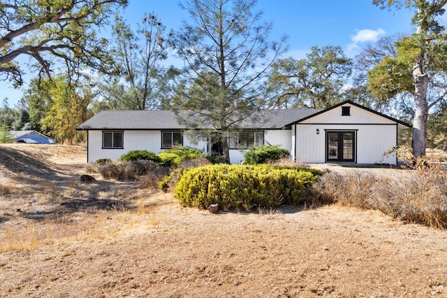 back of house featuring french doors