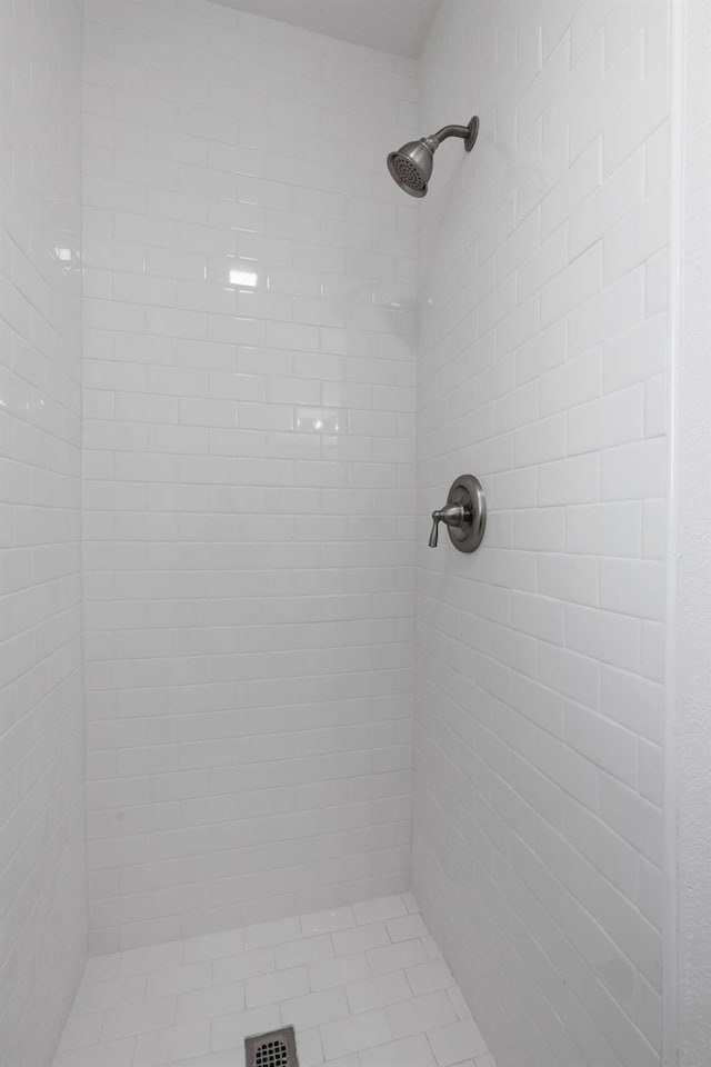 bathroom with a tile shower