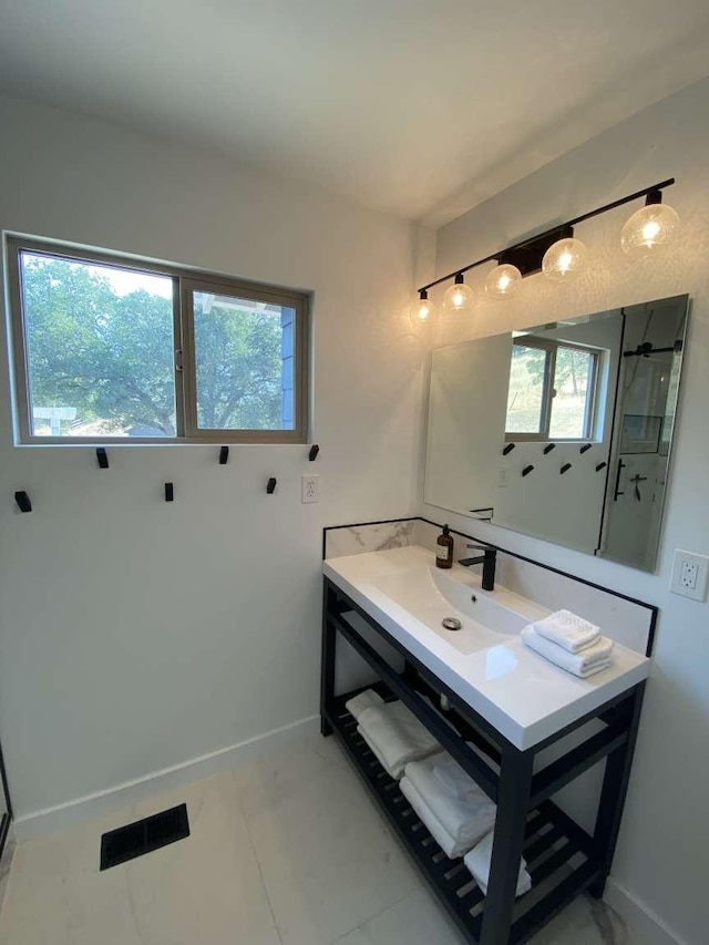 bathroom with vanity and tile patterned flooring