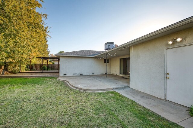 view of yard with a patio area and central AC