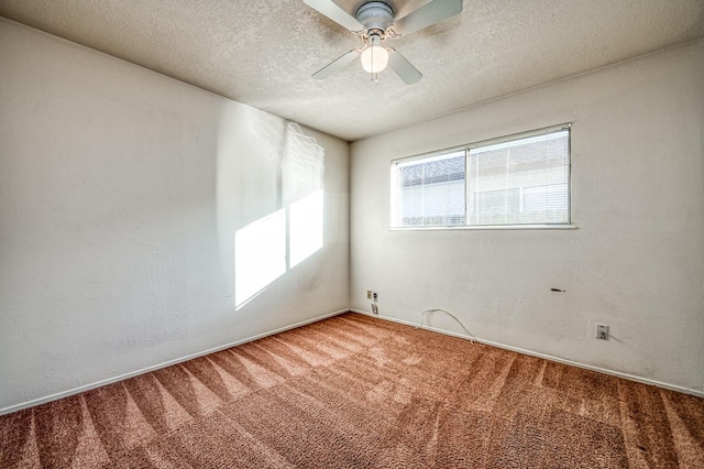 spare room with carpet flooring, a textured ceiling, and ceiling fan