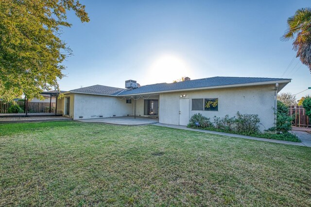 single story home with a patio area and a front lawn