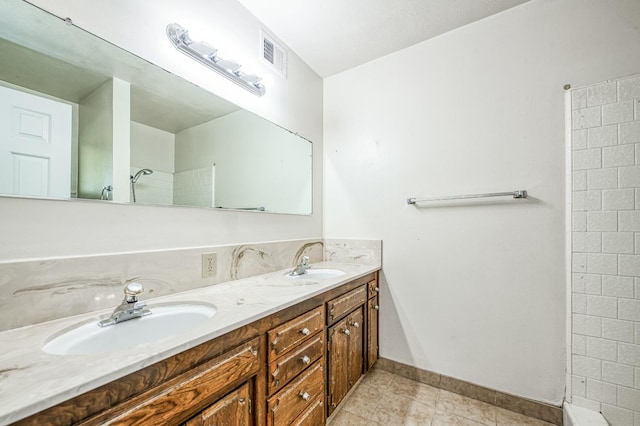 bathroom featuring vanity and tile patterned flooring