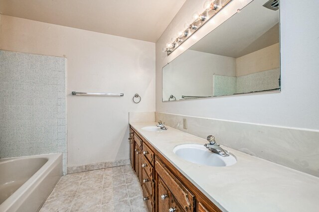 bathroom featuring tile patterned flooring and vanity