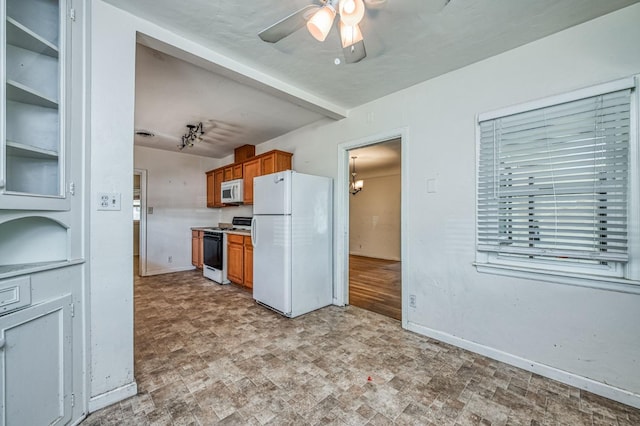 kitchen featuring ceiling fan and white appliances