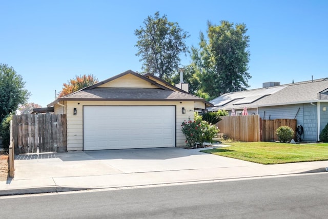 ranch-style house featuring a front yard and a garage