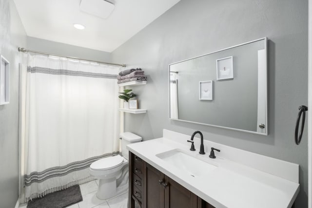 bathroom with tile patterned flooring, vanity, toilet, and a shower with shower curtain