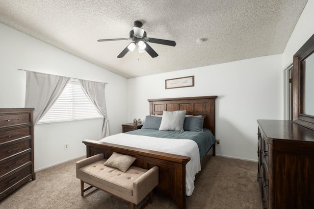 bedroom featuring a textured ceiling, light colored carpet, vaulted ceiling, and ceiling fan