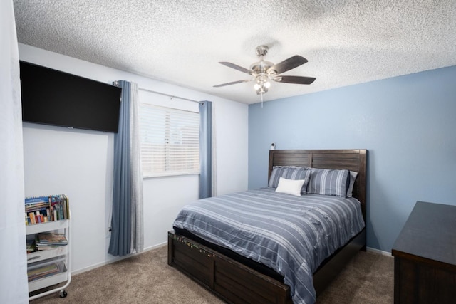 bedroom featuring carpet, a textured ceiling, and ceiling fan