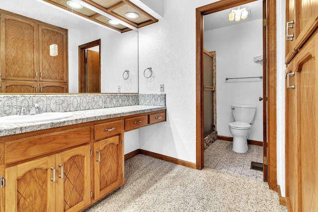 bathroom featuring tile patterned floors, walk in shower, backsplash, vanity, and toilet