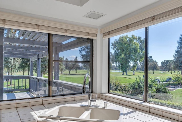 unfurnished sunroom featuring sink