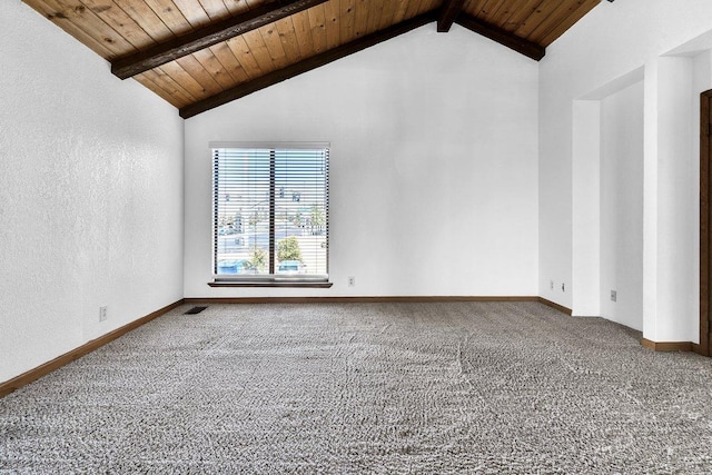 unfurnished room with wood ceiling, lofted ceiling with beams, and carpet