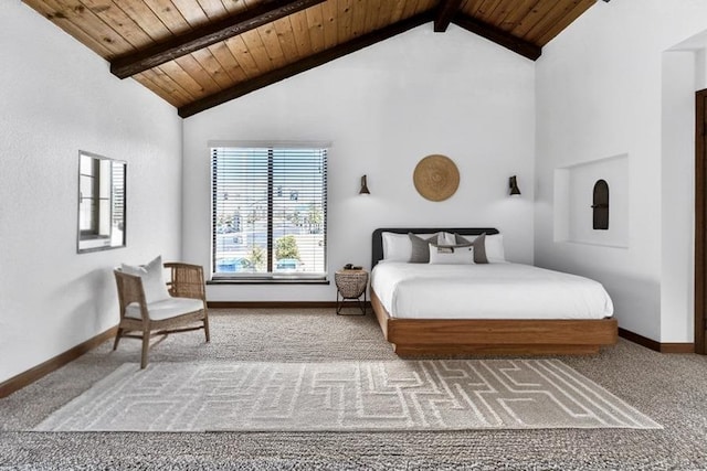 bedroom with wood ceiling, vaulted ceiling with beams, and carpet floors