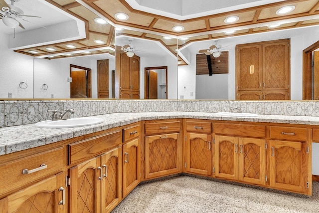 bathroom featuring vanity, tasteful backsplash, and coffered ceiling