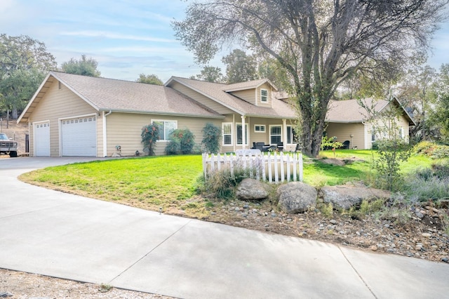 view of front of property with a garage and a front yard