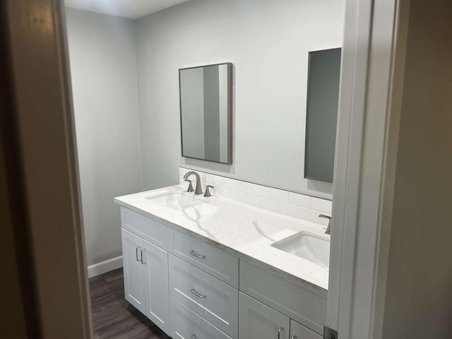 bathroom featuring vanity and wood-type flooring