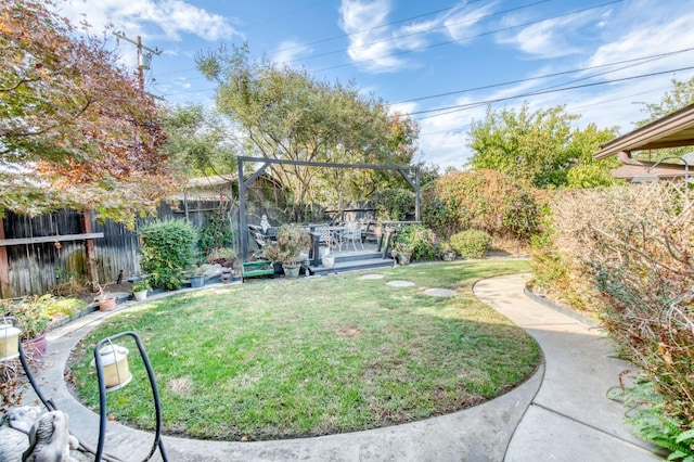 view of yard featuring a wooden deck