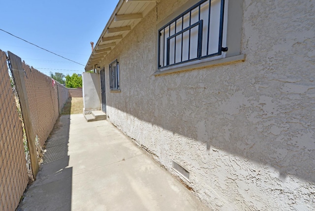 view of property exterior with a patio