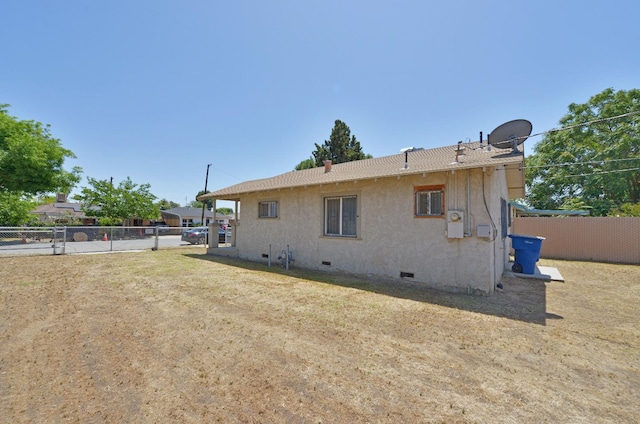 339 N Delno Ave, Fresno, CA 93706 - back of house featuring crawl space and stucco siding